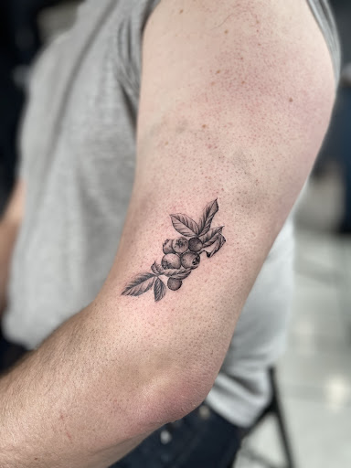 Explore flower tattoo ideas for females, creative tattoo ideas in Waterbury, available at Electric Radish Tattoo LLC