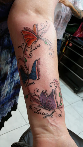 Explore rose sleeve tattoo ideas, creative tattoo ideas in Honolulu, available at Sacred Art Tattoo Waikiki