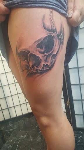 Explore ghost cat tattoo ideas, creative tattoo ideas in Rogers, available at Saved by Grace Tattoo Studio