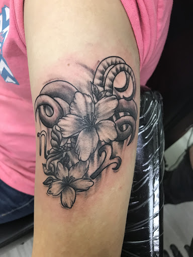 Explore trust no one tattoo ideas, creative tattoo ideas in Grenada, available at HeadSpace Tattoo