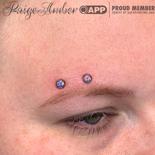 Explore breastfeeding tattoo ideas, creative tattoo ideas in Oshkosh, available at Piercings by Paige at Big Guns Tattoo