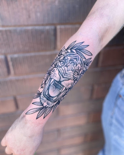 Explore black clover tattoo ideas, creative tattoo ideas in Peoria, available at Modern Ink Tattoo