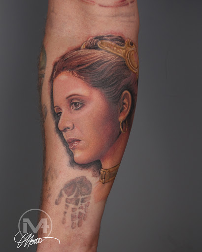 Explore lily tattoo ideas, creative tattoo ideas in Greenwood, available at Vault 74 Tattoo, LLC