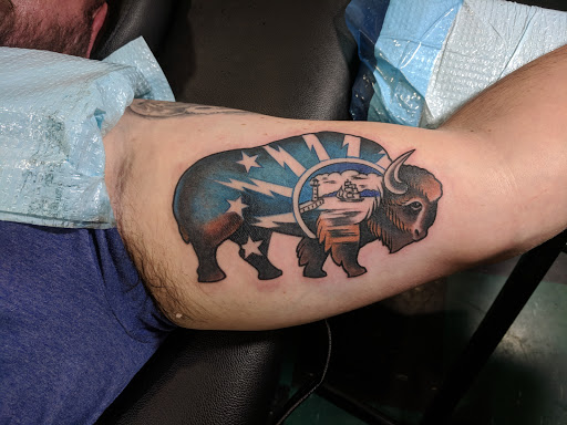 Explore badass tattoo ideas for men, creative tattoo ideas in Buffalo, available at Arboreal Ink - Tattoo and Piercing