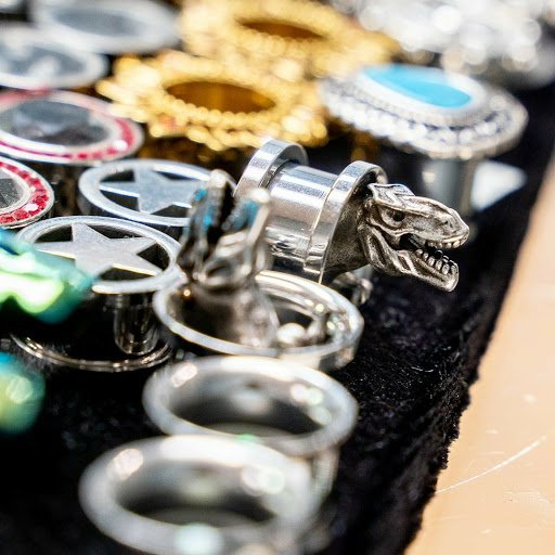 Explore elbow tattoo ideas men, creative tattoo ideas in Summerville, available at Exotic Impressions Body Piercing