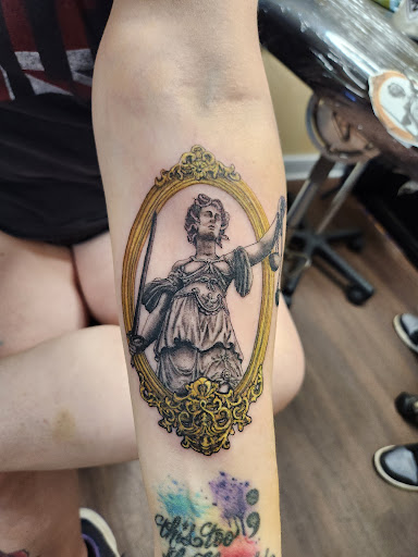 Find between breast tattoo ideas for your next unique tattoo in Richmond at Loose Screw Tattoo