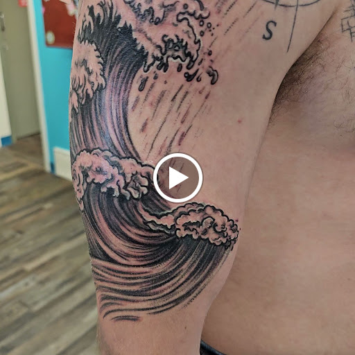 Explore fist tattoo ideas, creative tattoo ideas in Traverse City, available at Pinups & Needles