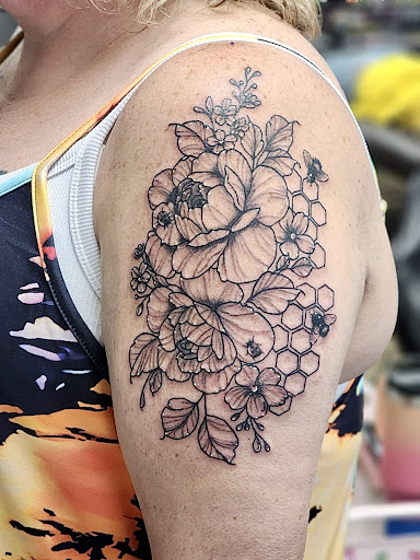 Find tummy tuck tattoo ideas for your next unique tattoo in Shelbyville at Stage Left Tattoo and Piercing