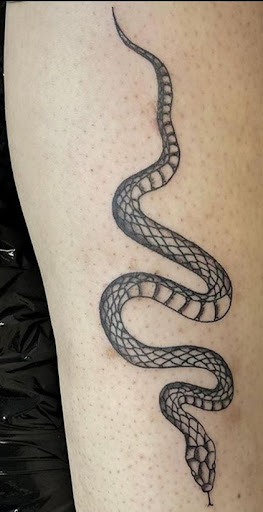 Explore book dragon tattoo ideas, creative tattoo ideas in Chandler, available at Ranger Tattoo & Piercing