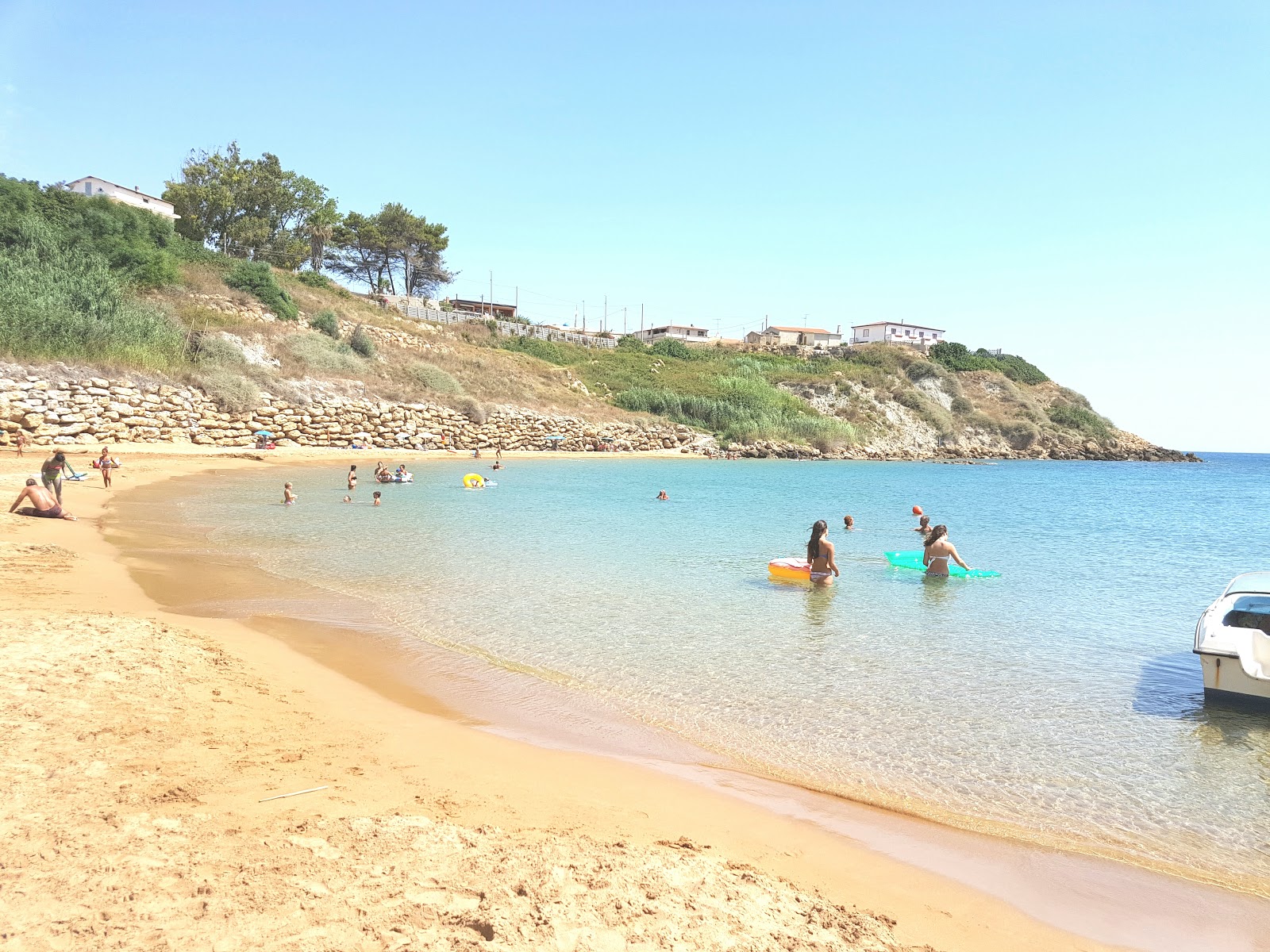 Foto van Spiaggia Capo Bianco met blauw water oppervlakte