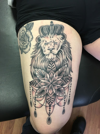 Explore back of the thigh tattoo ideas, creative tattoo ideas in Erie, available at Wayward Tattoo Studio