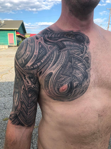 Explore ant tattoo ideas, creative tattoo ideas in Auburn, available at The Creative Edge Tattoo & Body Piercing