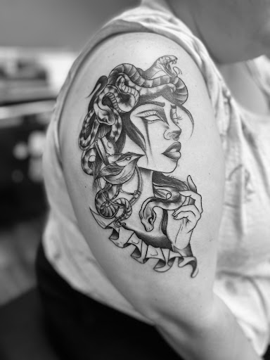 Explore black king tattoo ideas, creative tattoo ideas in Huntington, available at Golden Dagger Tattoos and Piercings