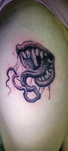 Explore tribal tattoo ideas and meanings, creative tattoo ideas in Angola, available at Hoodlum Ink