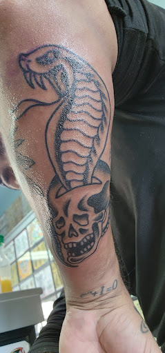 Find in between breast tattoo ideas for your next unique tattoo in Glenside at Glenside Tattoo