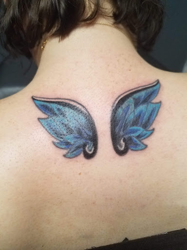 Explore flower back tattoo ideas, creative tattoo ideas in Athens, available at United Ink Tattoos and Body Piercings