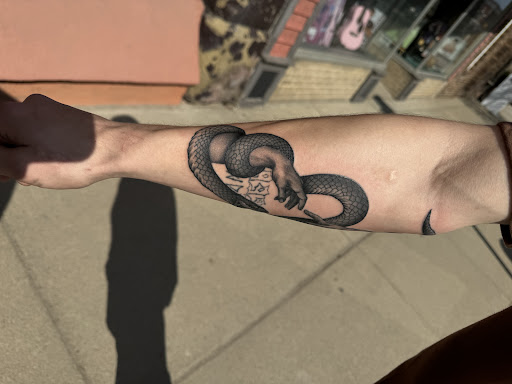 Explore mens back shoulder tattoo ideas, creative tattoo ideas in Cass City, available at Wolf Zen Tattoo