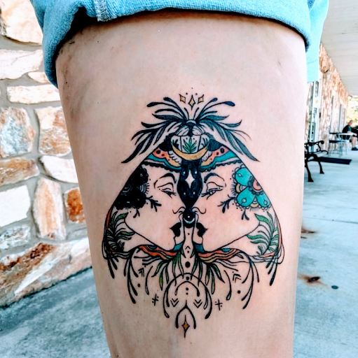 Explore sticker sleeve tattoo ideas, creative tattoo ideas in Lake City, available at Crooked Spines Tattoo Studio