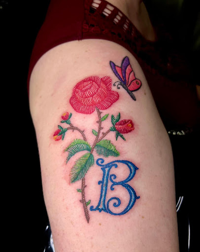 Explore simple neck tattoo ideas, creative tattoo ideas in Corcoran, available at La Raza Tattoo 2