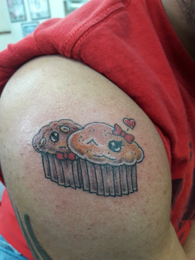 Explore peck tattoo ideas, creative tattoo ideas in Johnson City, available at House of Ink