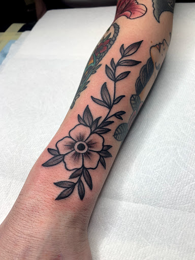 Explore guitar pick tattoo ideas, creative tattoo ideas in Prescott, available at BlackGold Tattoo