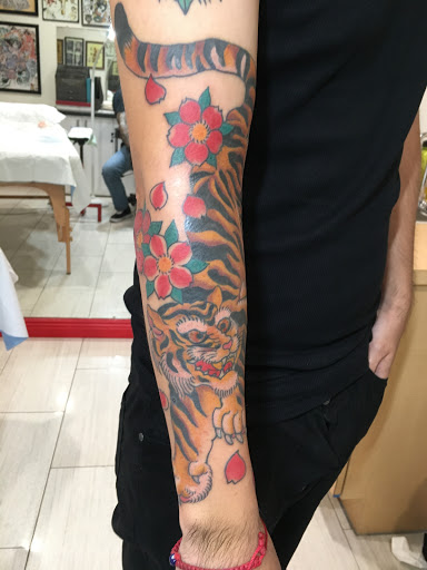 Explore dog bone tattoo ideas, creative tattoo ideas in Dallas, available at Carl Hallowell, Horisho