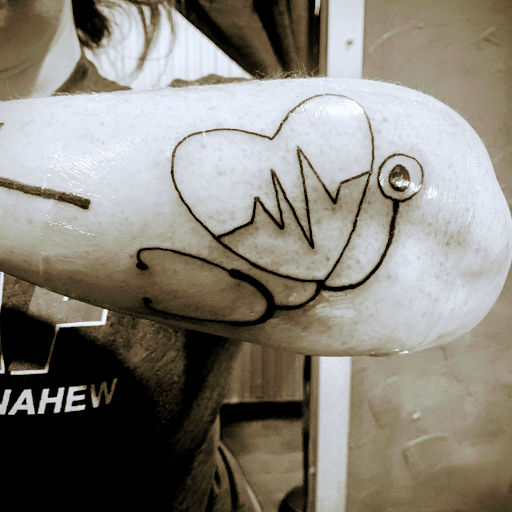 Explore arm tattoo men ideas, creative tattoo ideas in Denison, available at Crossroads Tattoo Studio