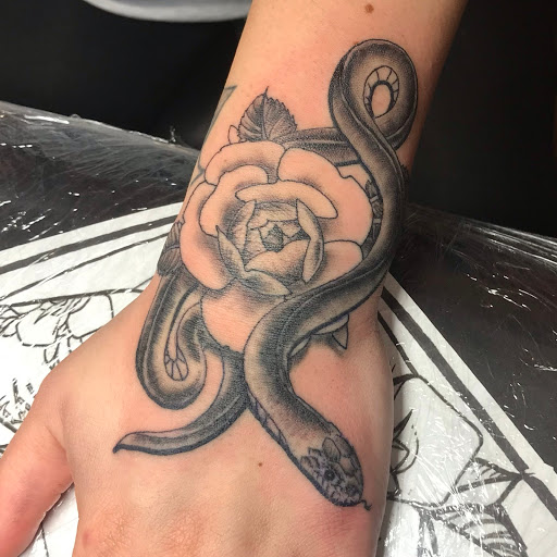 Explore tattoo ideas behind the ear, creative tattoo ideas in Washburn, available at Elevated Vision Tattoo Studio