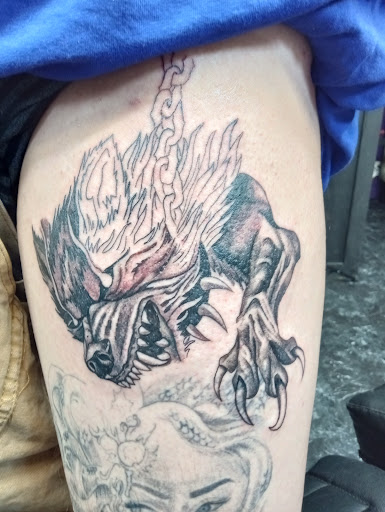Explore tattoo flag ideas, creative tattoo ideas in Denison, available at Mad House Tattoos