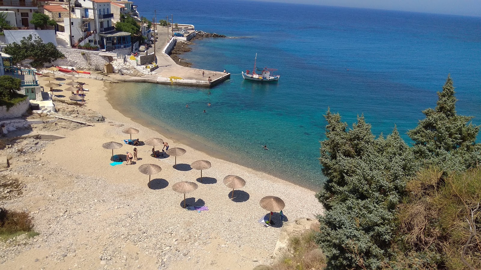 Photo of Armenistis beach II with black sand & pebble surface