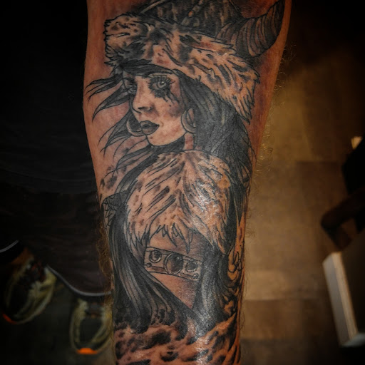 Explore half sleeve skull tattoo ideas, creative tattoo ideas in Gadsden, available at Sacred Art Tattoo Company