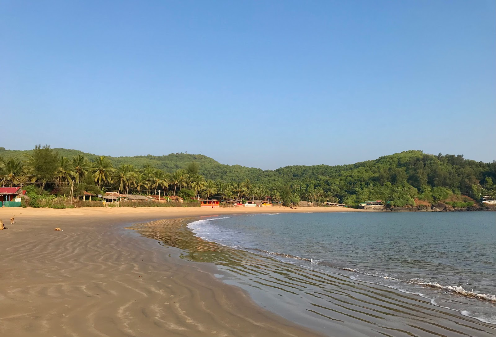 Foto von Om Beach und die siedlung