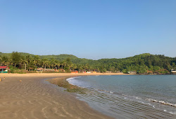 Foto von Om Beach und die siedlung