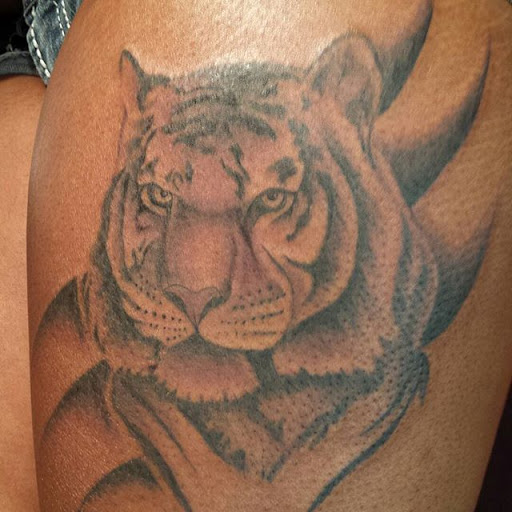 Explore hand tattoo ideas, creative tattoo ideas in Tupelo, available at Primal Ink Tattoo Studio