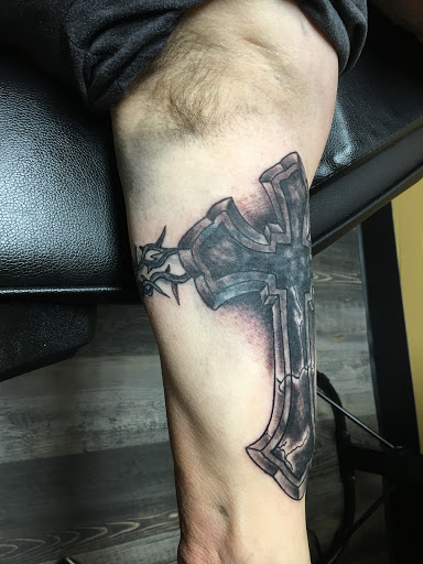 Explore name tattoo ideas on neck, creative tattoo ideas in Warner Robins, available at Untold Pain Tattoo Studio