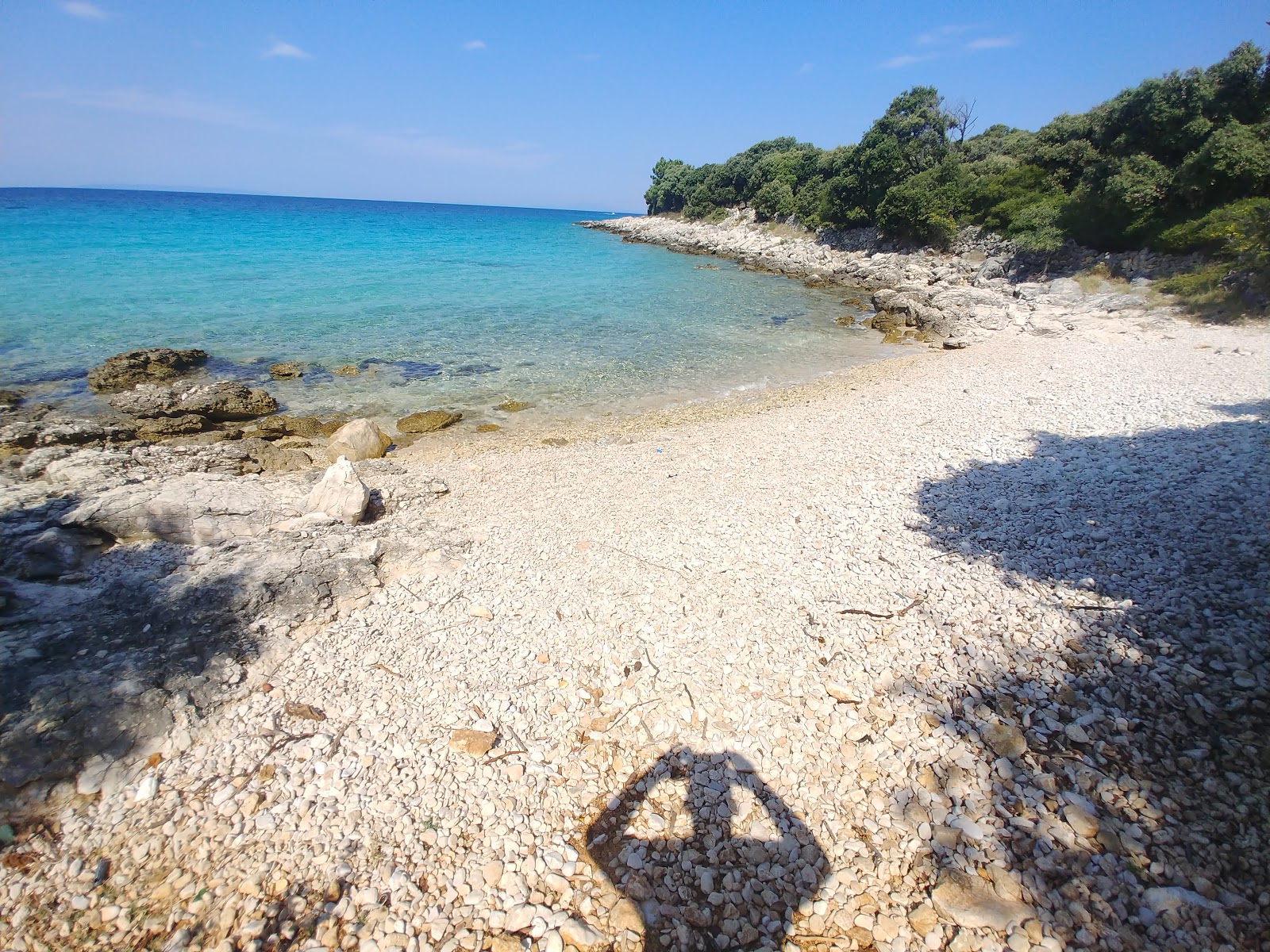 Foto von Raphael beach mit heller kies Oberfläche