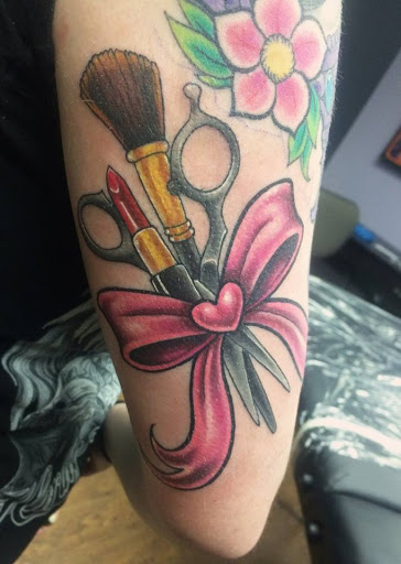 Explore spartan helmet tattoo ideas, creative tattoo ideas in Edgewood, available at Evolved Body Arts