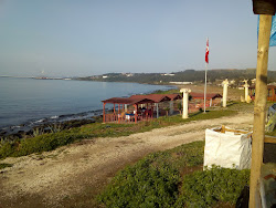 Foto von Botas beach II und die siedlung