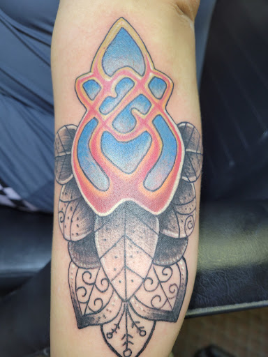 Explore big tattoo ideas for women, creative tattoo ideas in Angola, available at Hoodlum Ink