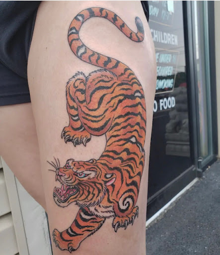 Find dragon tattoo ideas male for your next unique tattoo in Harrisonburg at Alley Cat Tattoo