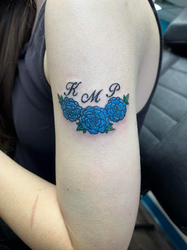 Explore rip cross tattoo ideas, creative tattoo ideas in Traverse City, available at Pinups & Needles