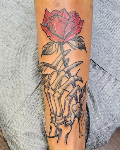 Find women's rib tattoo ideas for your next unique tattoo in Clive at Wild Rose Tattoo & Piercing