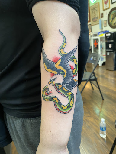 Explore purple flower tattoo ideas, creative tattoo ideas in Lakewood, available at Union Ave Tattoo Company