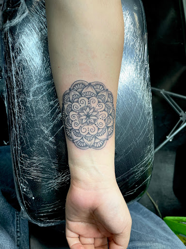 Explore purple flower tattoo ideas, creative tattoo ideas in Meridian, available at Creative Pain Tattoo Studio