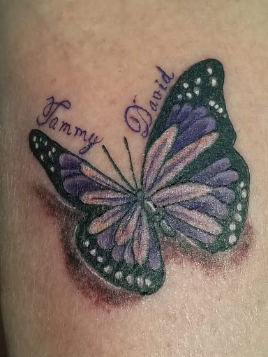 Explore full neck tattoo ideas for men, creative tattoo ideas in Toledo, available at Artistik Tat2 and Body Piercing