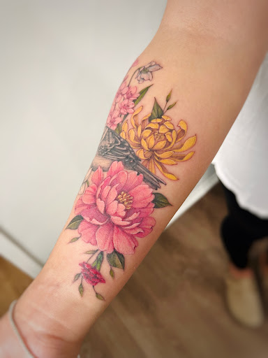 Explore mens upper back tattoo ideas, creative tattoo ideas in Montrose, available at The Story Blossom Tattoo Studio