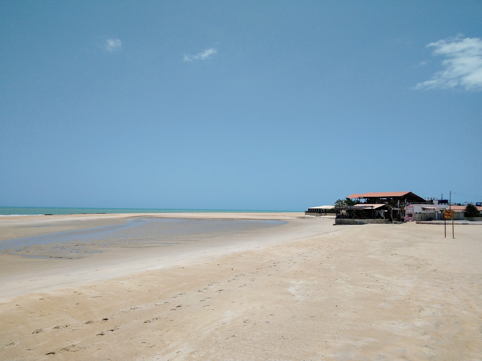 Fotografie cu Plaja Galinhos cu o suprafață de apa pură turcoaz