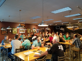 Friends sharing beers at a table
