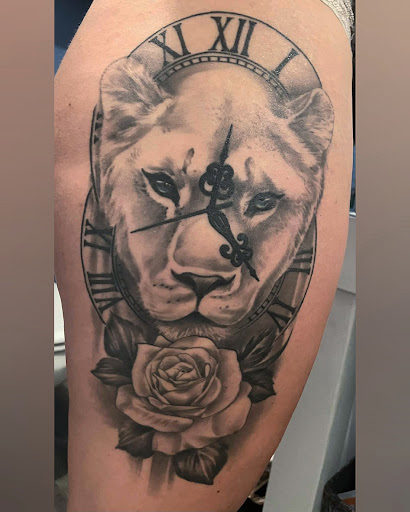 Explore tattoo ideas for women's lower back, creative tattoo ideas in New Castle, available at Antimatter Tattoo & Gallery