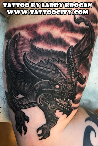 Explore bicep tattoo ideas for guys, creative tattoo ideas in Lockport, available at Tattoo City by Larry Brogan